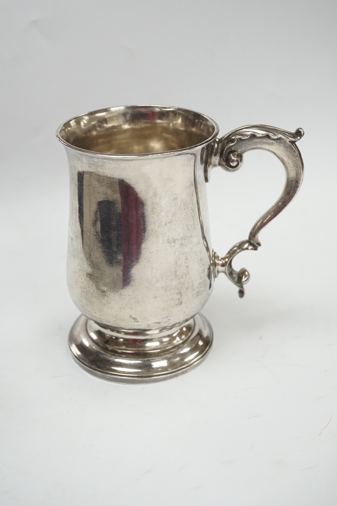 A George III silver baluster mug, William Turton, London, 1779, 12.5cm, 10.8oz. Condition - fair